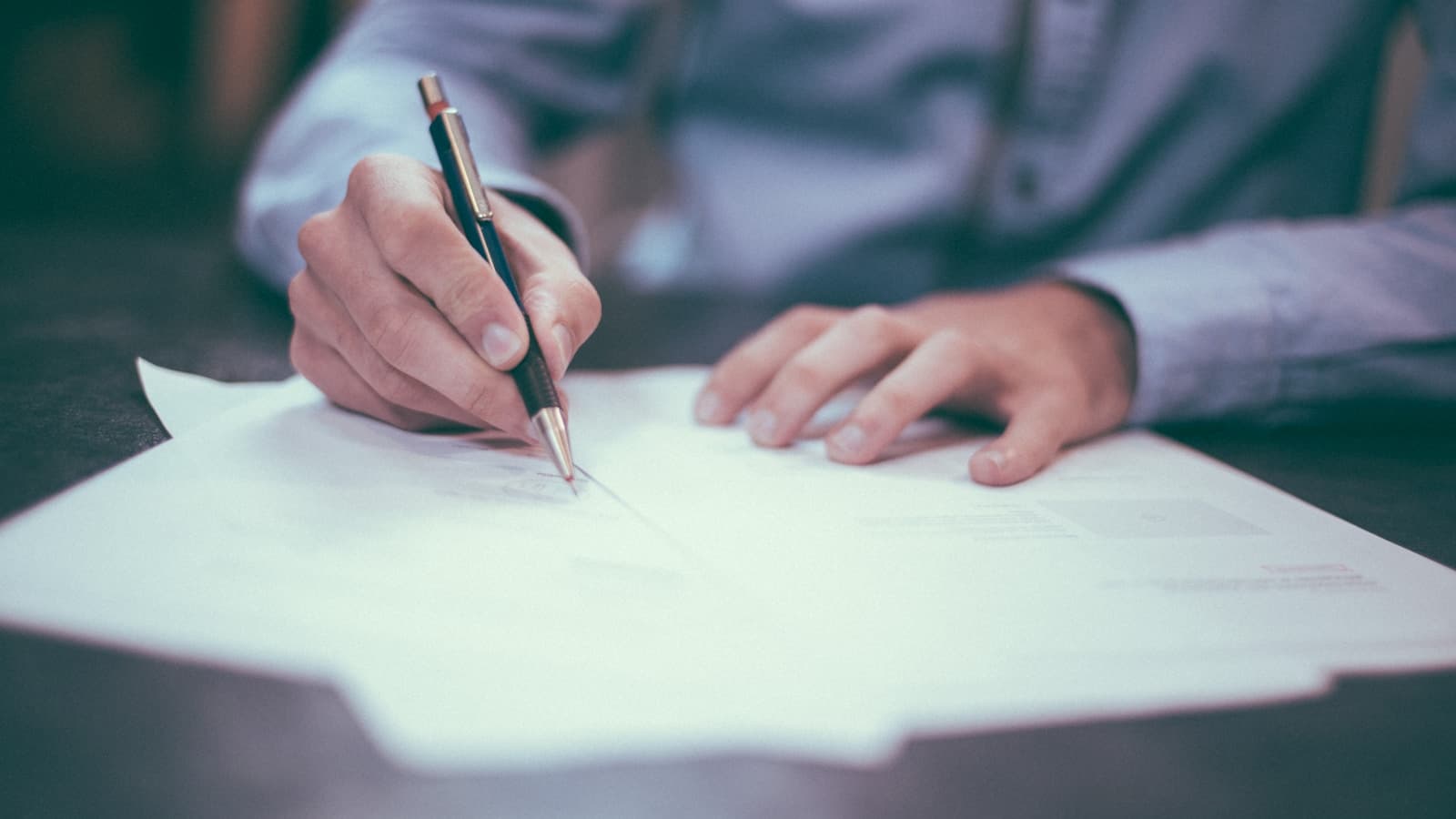 Person reviewing data protection documents at a desk