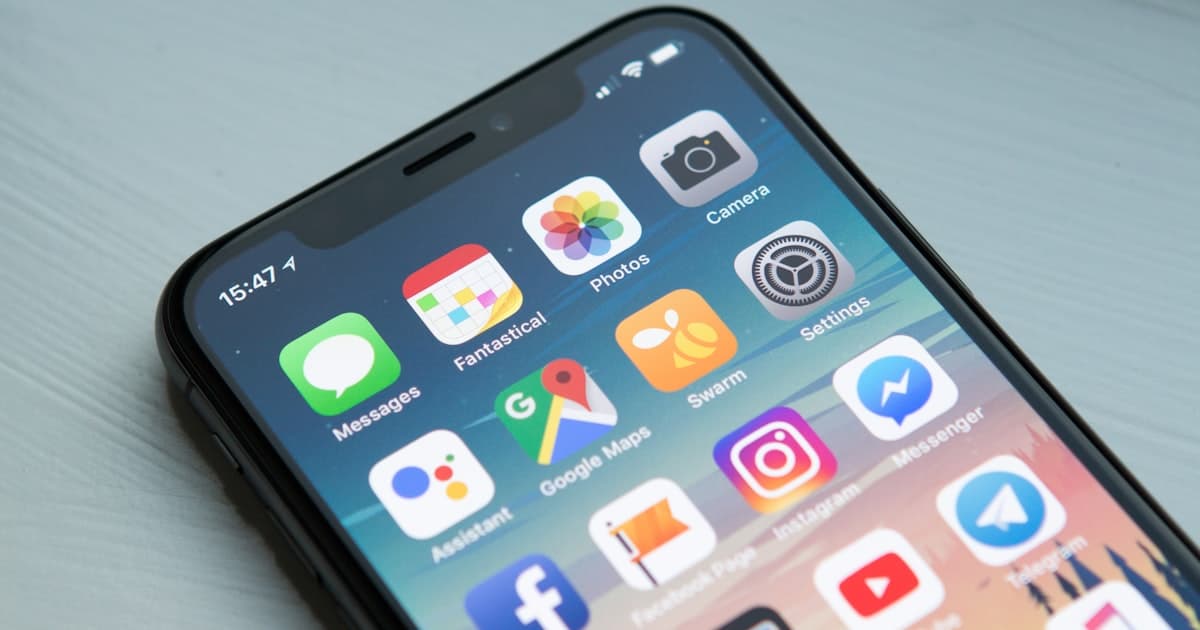 Person holding a smartphone, checking a missed call notification