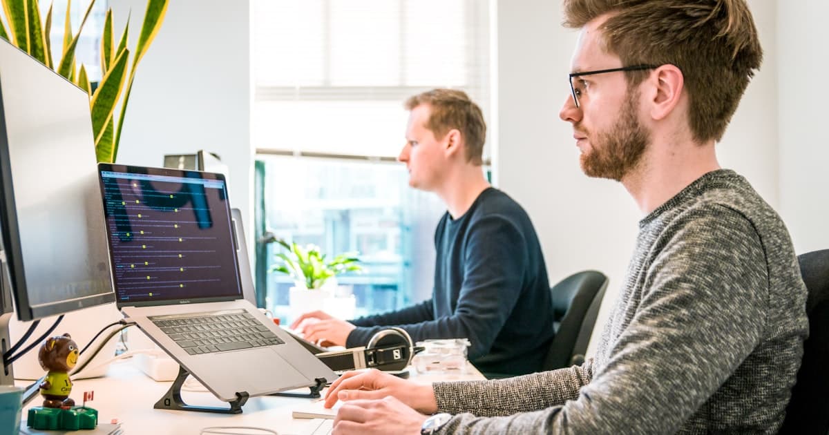 Small business team reviewing customer interactions on a laptop