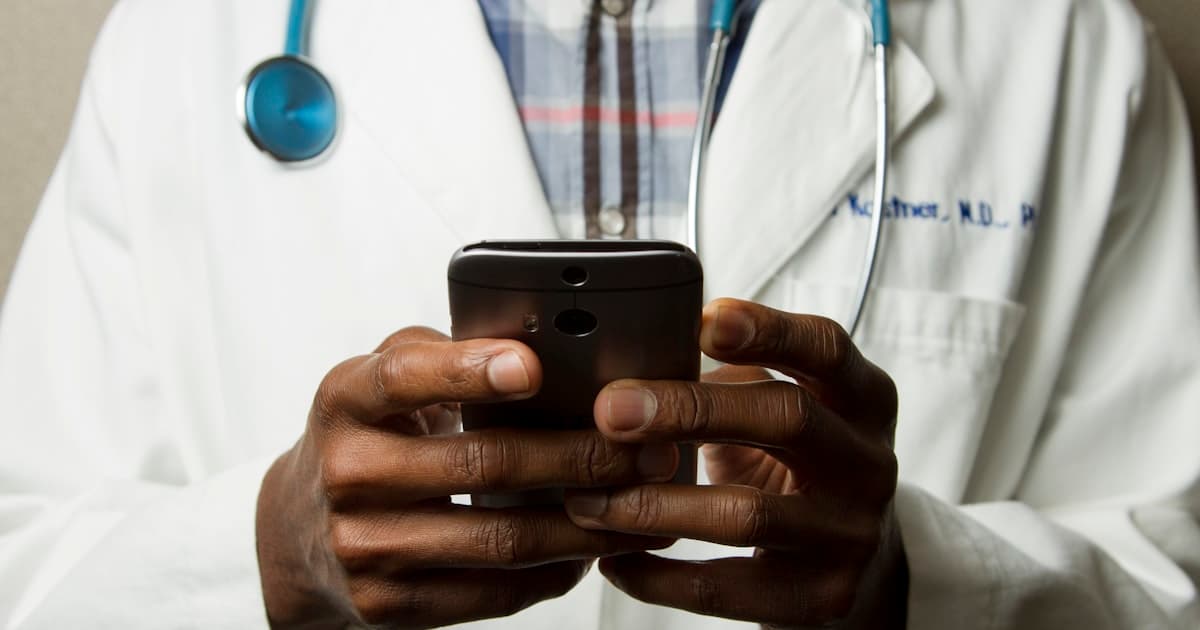 Reception desk of a modern clinic with a phone and appointment diary